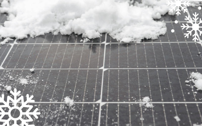 snow on a black solar panel