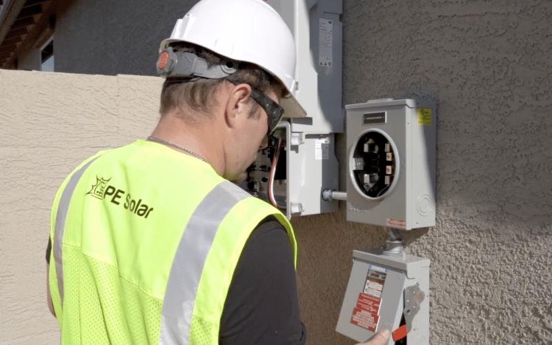 sun valley solar worker installing solar meter box