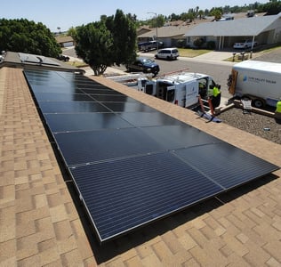black solar panels on shingle roof
