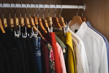 freepik-.lot-different-clothes-hanging-wardrobe