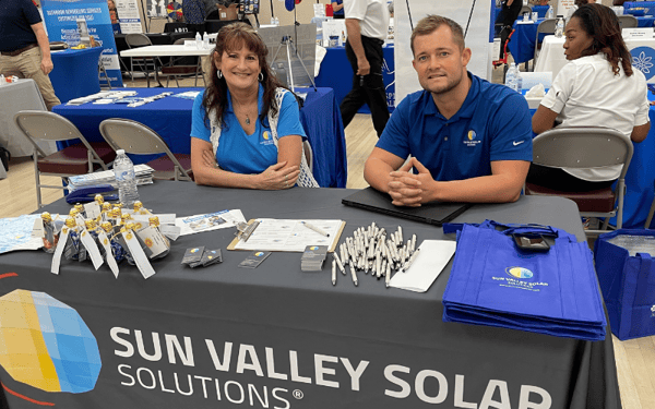 sun valley solar employees at desk in homeshow