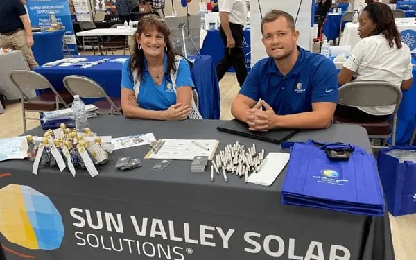 sun valley solar employees at desk in homeshow