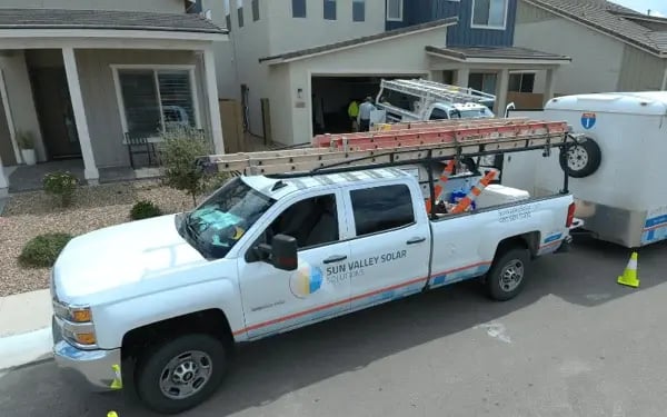 sun valley solar truck in front of house